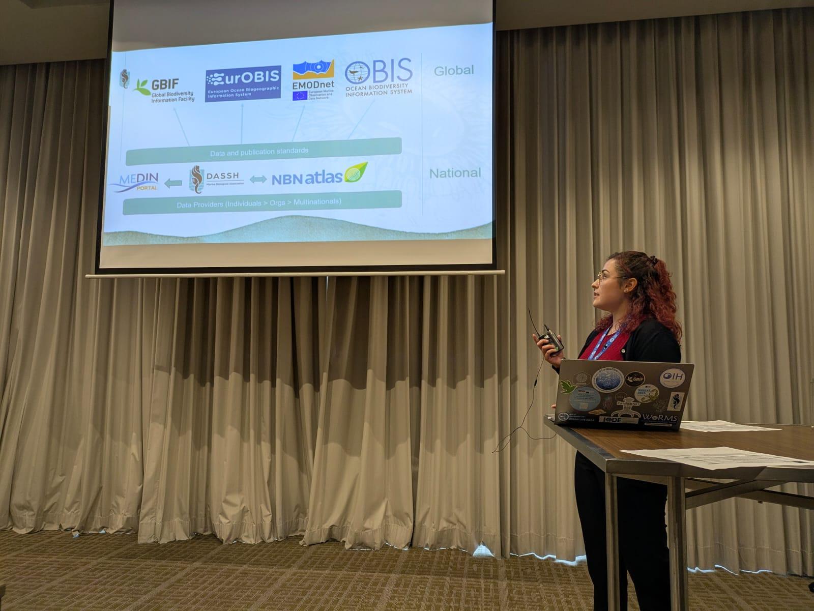 Chloe Figueroa during her presentation "From Shore to Server: Connecting Marine Civic Science to Global Biodiversity Data through DASSH and OBIS UK" at Living Data 2025 in Bogotá, Colombia.